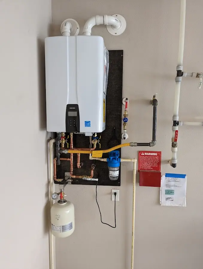 Professional plumber installing copper piping in a Hillsboro home